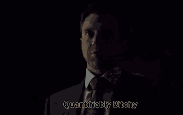 a man in a suit and tie says " quantifiable bitchy "