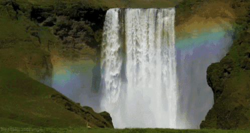 a waterfall with a rainbow in the background and the words nerdlikeastrange below it