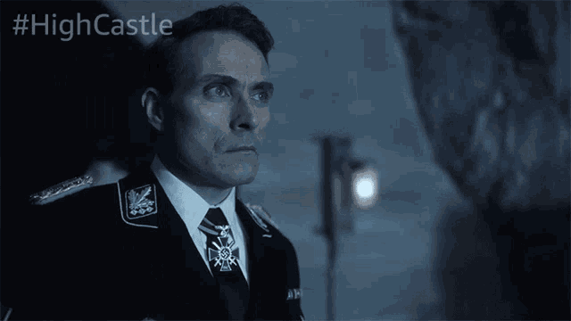 a man in a military uniform with the hashtag #highcastle on the bottom