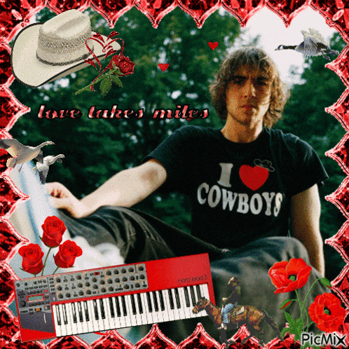 a man wearing a shirt that says i love cowboys sits in front of a keyboard