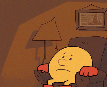 a cartoon of a man sitting in a chair with a framed picture of a monkey on the wall