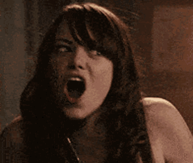 a woman with her mouth open and a necklace on her neck