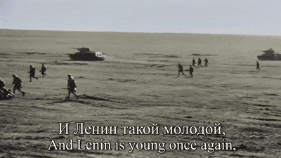 a black and white photo of soldiers in a field with a caption that says and lenin is young once again