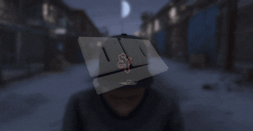 a man wearing a hat that says alien on it