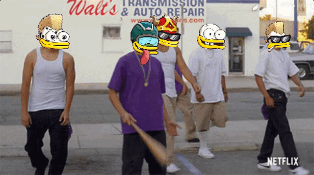 a group of men walking down a street in front of a walt 's transmission and auto repair store