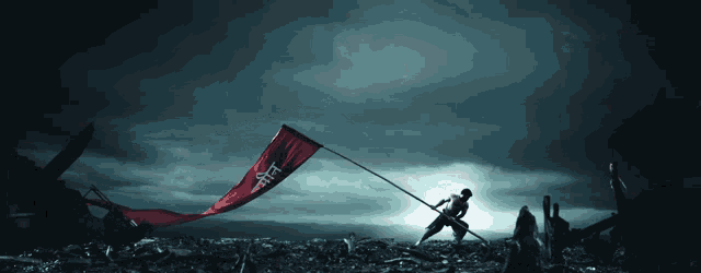 a man is holding a red flag that says ' freedom '