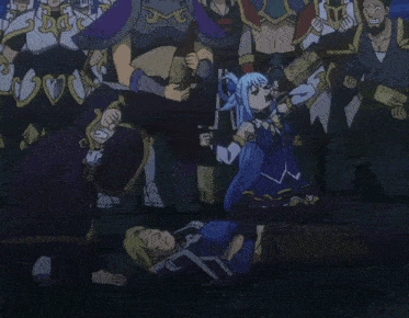 a group of people are standing around a person laying down