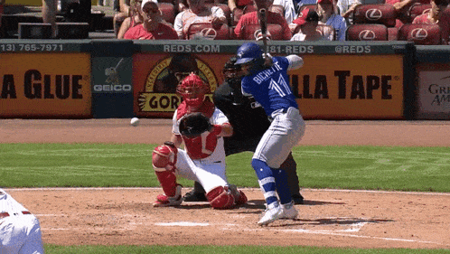 a baseball player with the number 11 on his jersey swings at the ball