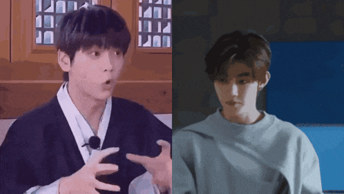a man in a black kimono and a man in a blue sweater are talking to each other
