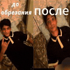 a man is laying on a bed and making a peace sign in russian .