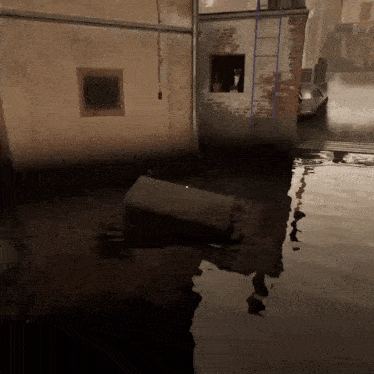 a flooded area with a ladder and a boat