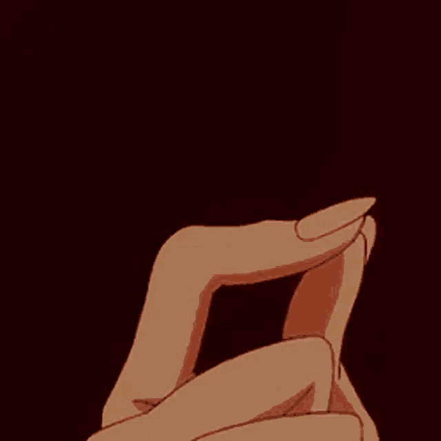 a close up of a person 's hands holding a pink lightning bolt .