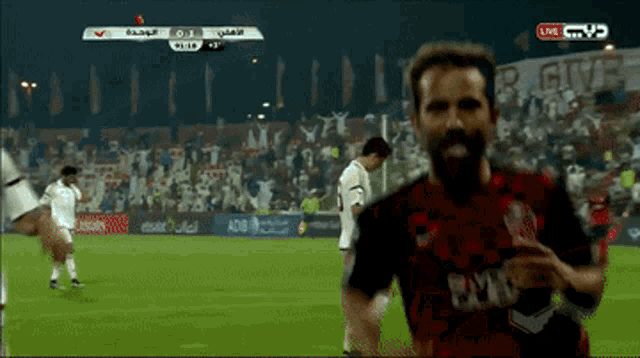 a soccer game is being shown live on a tv