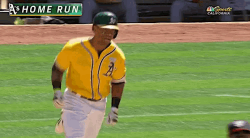 a baseball player in a yellow jersey with the letters a on it