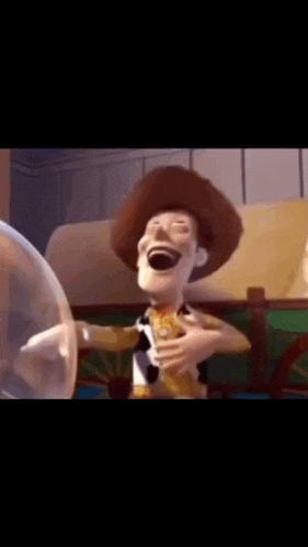 a close up of a toy story character laughing