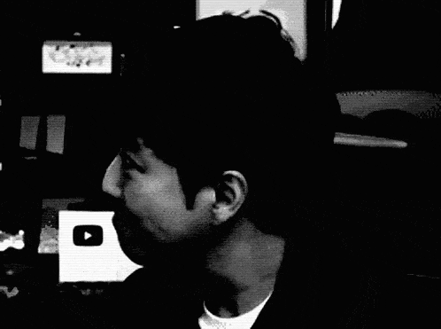 a blurry black and white photo of a man