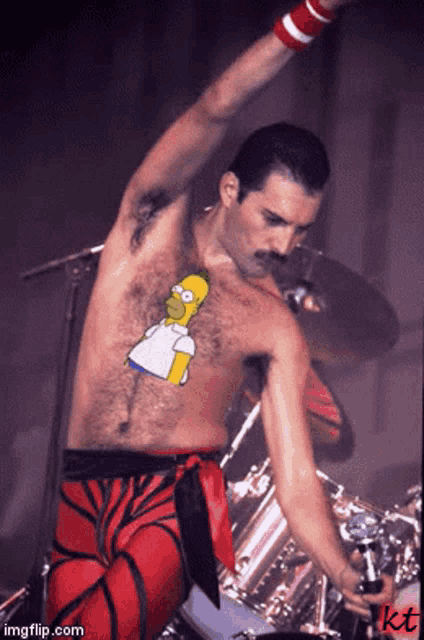 a shirtless man with homer simpson on his chest is holding a microphone