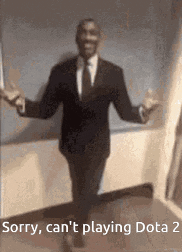 a man in a suit and tie is dancing with the words sorry , can 't playing dota 2 below him