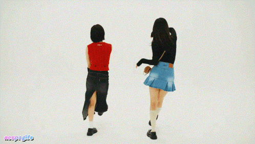 two women are dancing in front of a white background with the word aespa written on the bottom