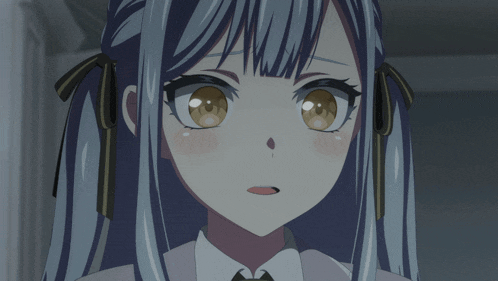a close up of a girl 's face with blue hair