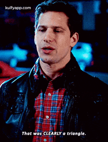 a man wearing a plaid shirt and a leather jacket says that was clearly a triangle