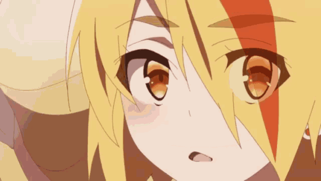 a close up of a cartoon character 's face with yellow hair and brown eyes .