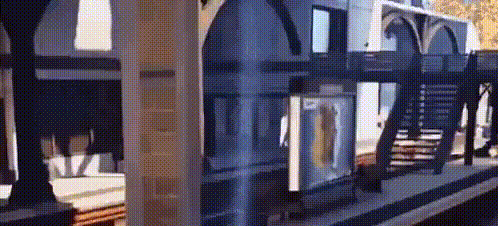 a model of a building with stairs going up to the second floor