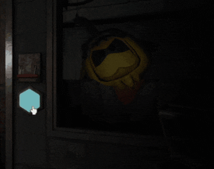 a hand is pointing at a blue circle in a dark room