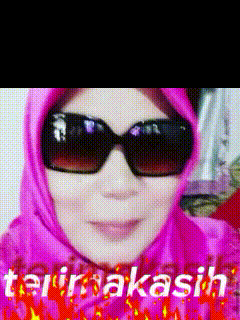 a woman wearing sunglasses and a pink head scarf with the words terima kasih written on it