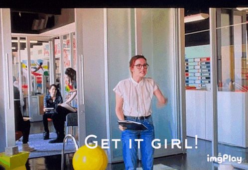 a tv screen shows a woman holding a clipboard and the words get it girl on the bottom