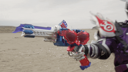 a person is holding a toy gun with a red white and blue design on it