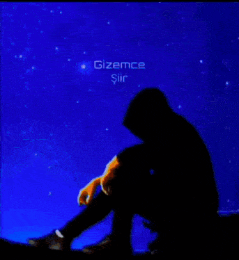 a silhouette of a person sitting on a roof holding a balloon in front of a full moon