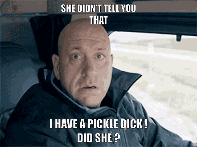 a bald man is sitting in a car with the caption she did n't tell you that