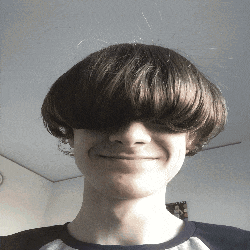 a young man with a very large fringe on his head