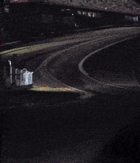 a car is driving down a highway at night with a sign that says ' o'neill ' on it