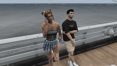 a man and a woman are standing on a pier and the man is wearing a shirt that says " i love you "