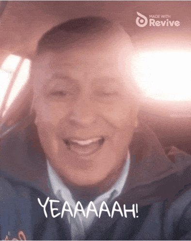 a man in a car with the words yeaaaah written on the bottom