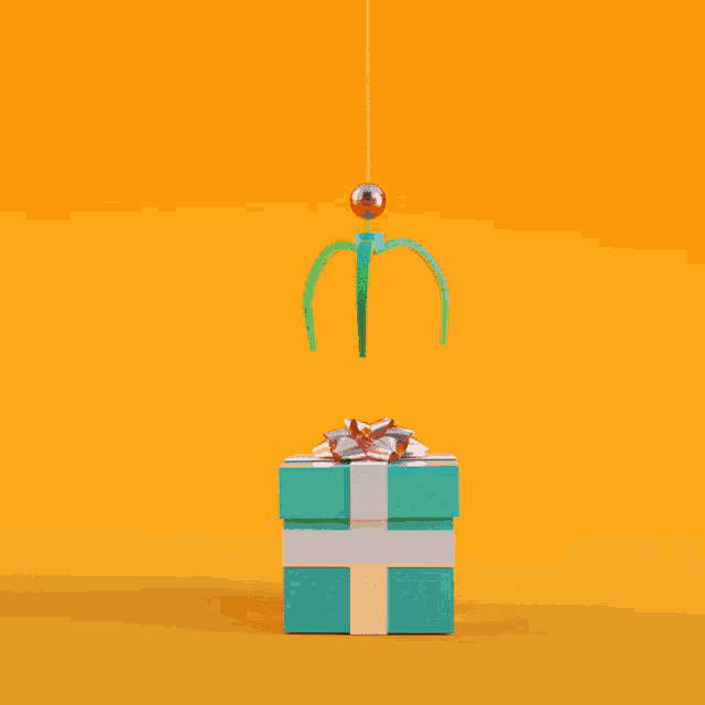 a green gift box with a white cross on it is open