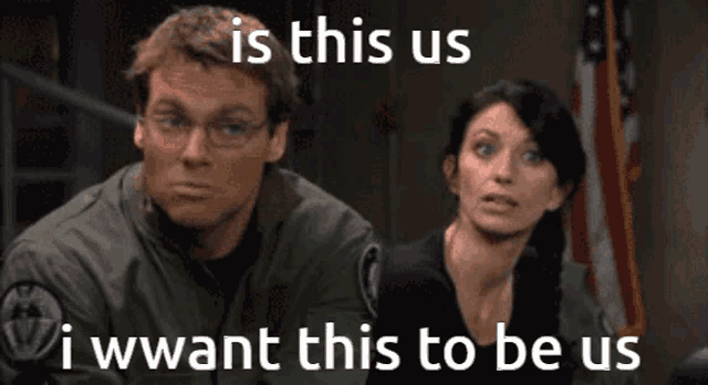 a man and a woman are sitting in front of an american flag with the caption " is this us "