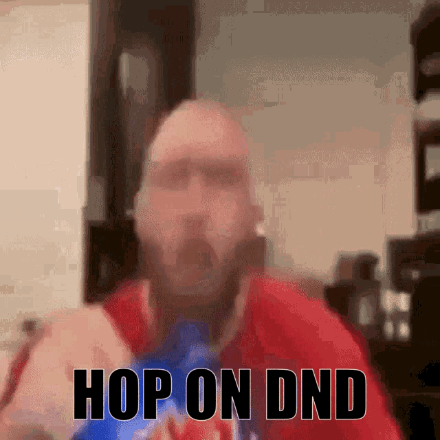 a man in a red shirt says hop on dnd in a blurry photo