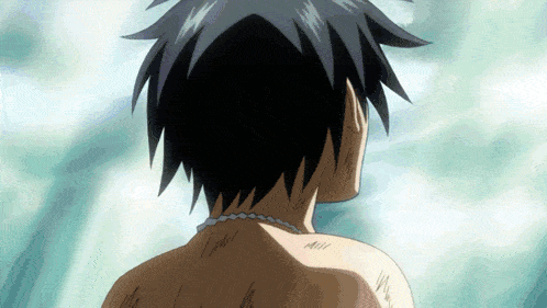 a close up of a person 's back with a necklace
