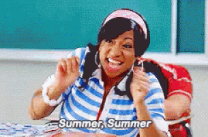 a girl in a striped shirt is sitting at a table and saying summer summer