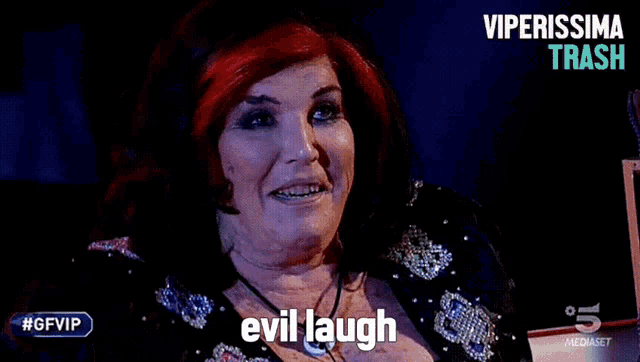 a woman with red hair is smiling with the words evil laugh above her