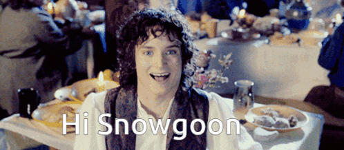 a man sitting at a table with the words hi snowgoon on the bottom