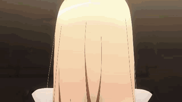 a close up of a person 's head with blonde hair