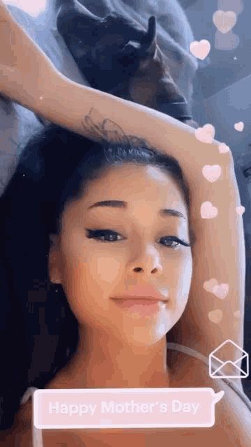 a woman laying in bed with her arm over her head and a speech bubble saying happy mother 's day