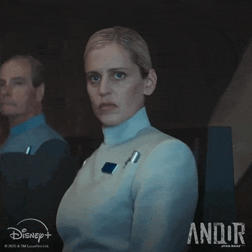 a woman in a white uniform with the word andor on the bottom right