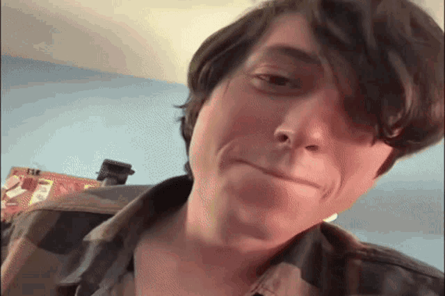 a close up of a person 's face making a funny face