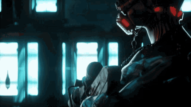 a person wearing a gas mask and headphones is sitting in front of a window
