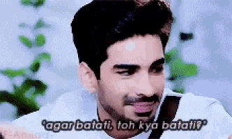 a man with a beard is making a funny face and says agar batati toh kya batati ?